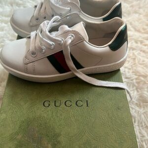 Gucci boys sneakers size 10 toddler but run a little small fits more a 9.5